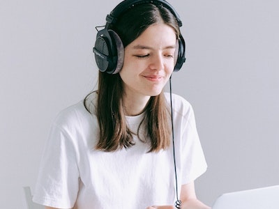 Girl in white enjoying music
