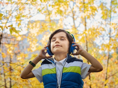 kid enjoying headphone music