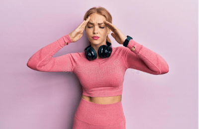Girl in pink feeling headache